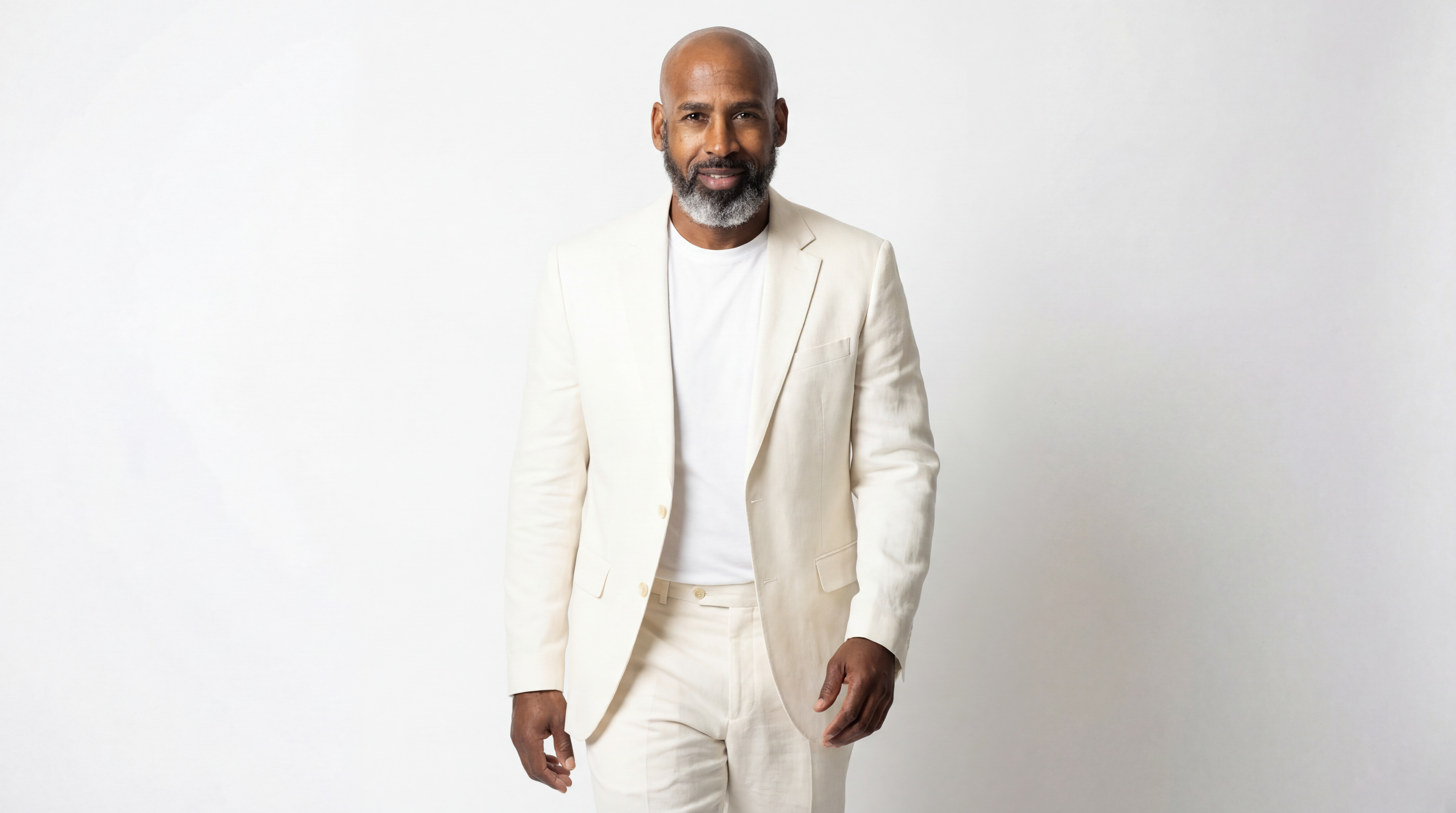 Artist in an off-white suit